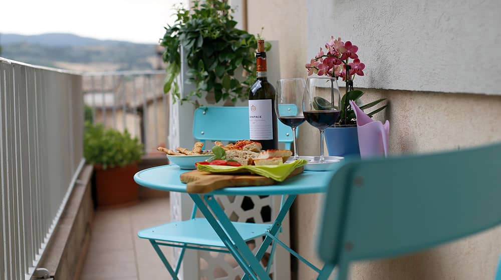 Clio. A balcony surrounding the apartment. Le Muse Holiday Apartments Bevagna historic center
