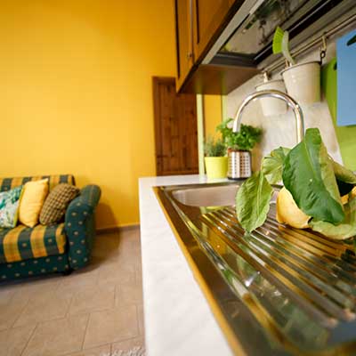 Talia. Equipped open kitchenette. Le Muse Vacation Apartments Bevagna historic center