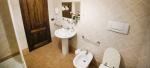 Bathroom with walk-in shower and washing machine- Clio Holiday Apartment in Bevagna, Umbria, Italy