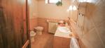Bathroom with walk-in shower and washing machine - Melpomene Holiday Apartment in Bevagna, Umbria, Italy