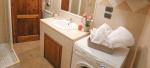 Bathroom with shower and washing machine - Talia Vacation Apartment in Bevagna, Umbria, Italy