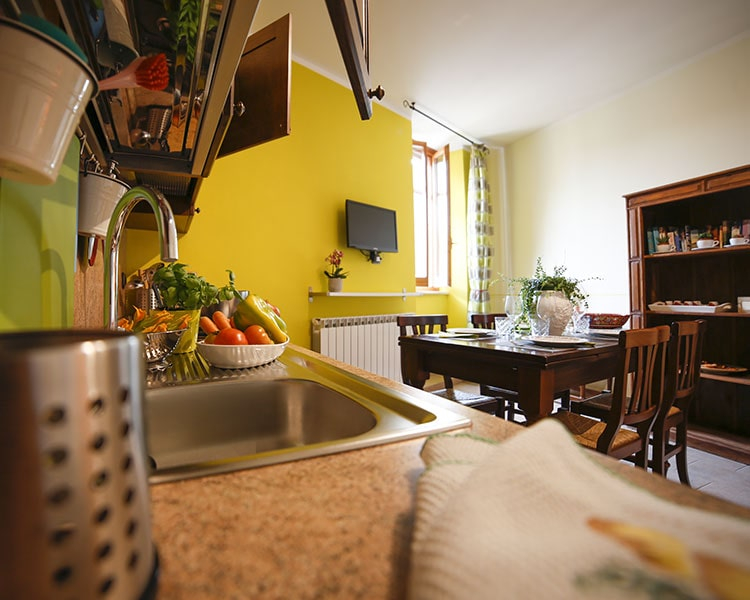 Living area with the well-equipped kitchenette - Le Muse vacation apartment Bevagna, Umbria, Italy