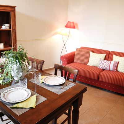 Tersicore. Large living area with kitchenette and sofa bed. Le Muse Holiday Apartments Bevagna historic center